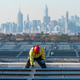 IBEW Local 3 workers install a solar panel on top of LaGuardia Airport in New York City.